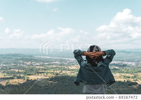 Woman travel around the world with backpack freedom and relax life. 69167472