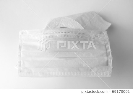 Toilet paper and medical mask. The panic of the coronavirus epidemic. 69170001