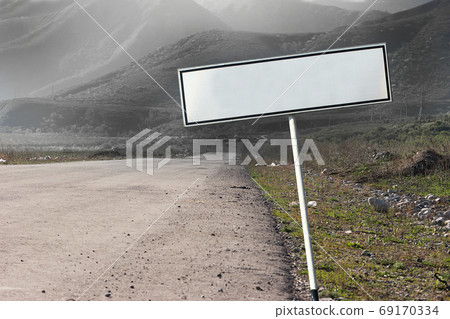 Empty blank road sign concept. The path extending into a gloomy distance Empty blank road sign concept. The path extending into a gloomy distance 69170334