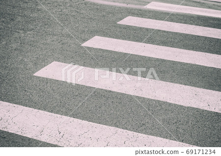 Zebra crossing painted on the asphalt traffic information for pedestrians and drivers Zebra crossing painted on the asphalt traffic information for pedestrians and drivers 69171234
