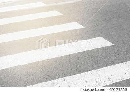 Zebra crossing painted on the asphalt traffic information for pedestrians and drivers Zebra crossing painted on the asphalt traffic information for pedestrians and drivers 69171236