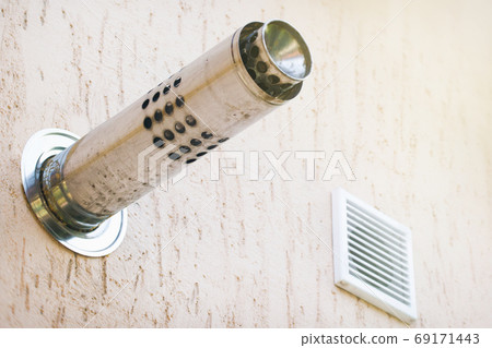 Munich plaster wall with gas chimney and ventilation hole 69171443