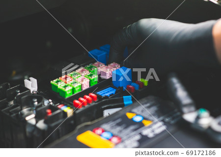 Mechanic checking fuse and relay box controller 69172186