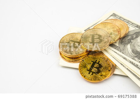 Golden Bitcoins of new digital money on banknotes Golden Bitcoins of new digital money on banknotes 69175388