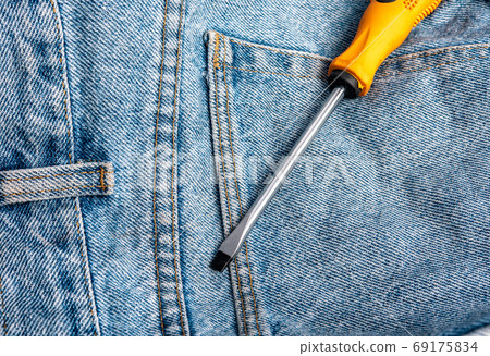 Orange crimping tools on jeans floor, anti-rust magnet technology, hard network technology 69175834