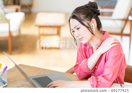 Tired young woman in telework Tired young woman in telework 69177425