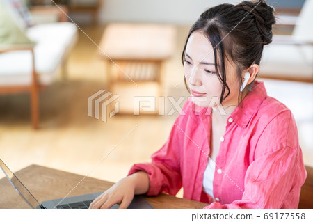 Tired young woman in telework Tired young woman in telework 69177558