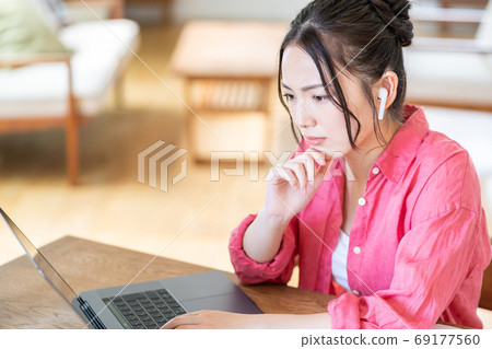 Tired young woman in telework Tired young woman in telework 69177560