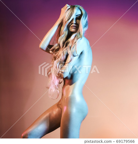 Nude sexy blonde in colorful light. Night club dance Nude sexy blonde in colorful light. Night club dance 69179566