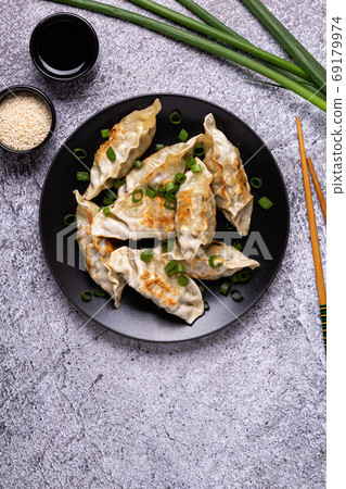 Fried dumplings Gyoza on a plate  69179974