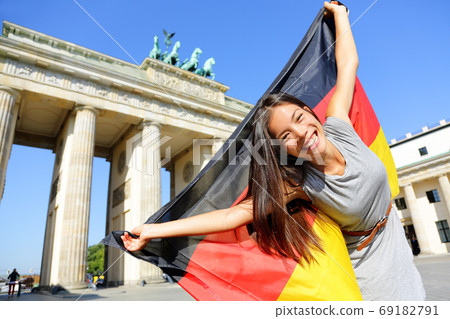 German flag woman happy at Berlin Germany German flag woman happy at Berlin Germany 69182791