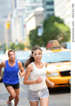 Running workout in New York City - Runners couple Running workout in New York City - Runners couple 69182796