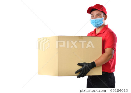 Asian delivery man, medical face mask, carry cardboard box in hands isolated on white background Asian delivery man, medical face mask, carry cardboard box in hands isolated on white background 69184013