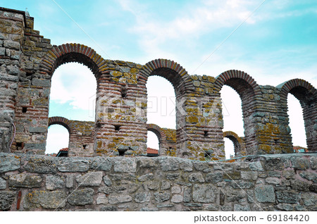 ancient fortress without a roof against the sky. Bottom view ancient fortress without a roof against the sky. Bottom view 69184420