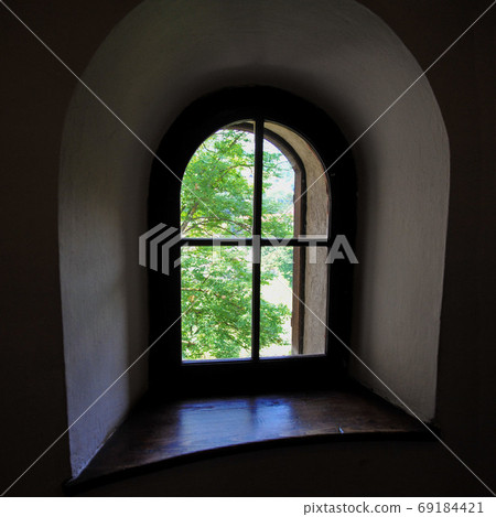 old window to the street from a dark room old window to the street from a dark room 69184421