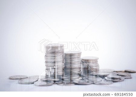 Double exposure of coins on the white background for finance and banking concept 69184550