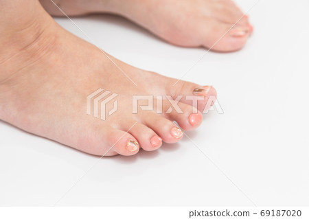 Women's feet with nail stickers 69187020