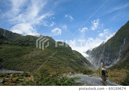 Active senior man traveling Franz Joseph Glacier in Westland National Park, South Island, New Zealand Active senior man traveling Franz Joseph Glacier in Westland National Park, South Island, New Zealand 69189674