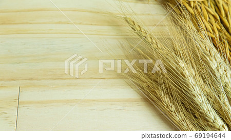 Barley and Oat on wood table for food content. Barley and Oat on wood table for food content. 69194644