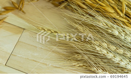 Barley and Oat on wood table for food content. Barley and Oat on wood table for food content. 69194645