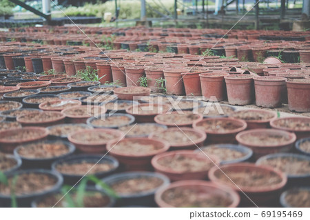 soil & fertilizer in planting pot for growing plant seedling in 69195469