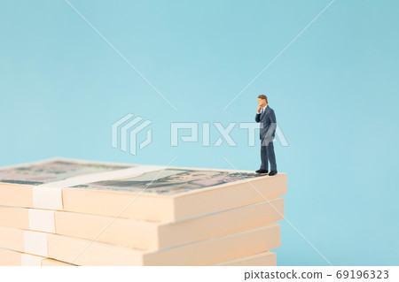 Businessman image to worry about money Businessman image to worry about money 69196323