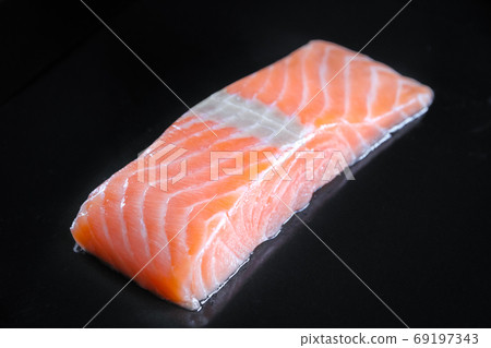 Salmon steak isolated on black background Salmon steak isolated on black background 69197343