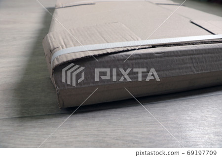 Disassembled furniture in cardboard packaging on the floor. Disassembled furniture in cardboard packaging on the floor. 69197709