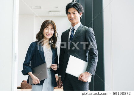 Young male and female business person portrait 69198872