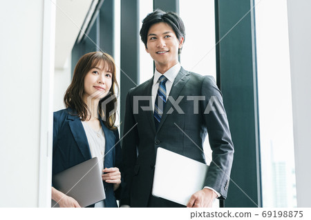 Young male and female business person portrait 69198875