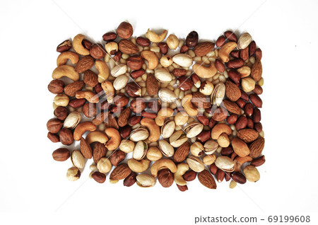assorted nuts on a white background 69199608