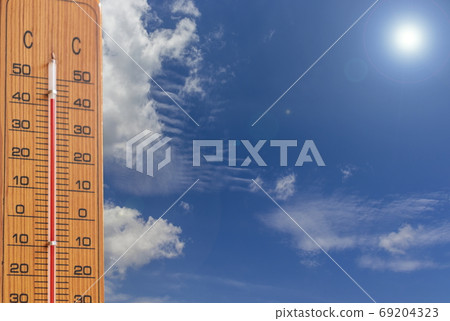 Image of summer _ intense heat thermometer, sun and sky Image of summer _ intense heat thermometer, sun and sky 69204323