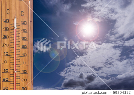Image of summer _ intense heat thermometer, sun and sky Image of summer _ intense heat thermometer, sun and sky 69204352
