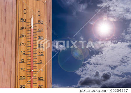 Image of summer _ intense heat thermometer, sun and sky Image of summer _ intense heat thermometer, sun and sky 69204357