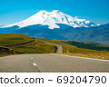Panorama road leading to the Jilli-su trace against the background of the highest peak in Europe, mount Elbrus  69204790