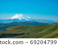 Europe's Highest Mountain Peak, Elbrus, Green Hills On A Sunny Summer Day. Caucasus, Russia 69204799