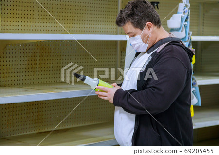 Supermarket interior with man medical protective 69205455