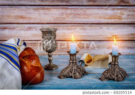 Shabbat with challah bread on a wooden table 69205514