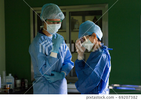 Medical staff wearing surgical clothes 69207382