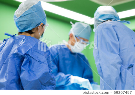 Medical staff performing surgery Medical staff performing surgery 69207497