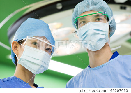 Medical staff wearing surgical clothes 69207610