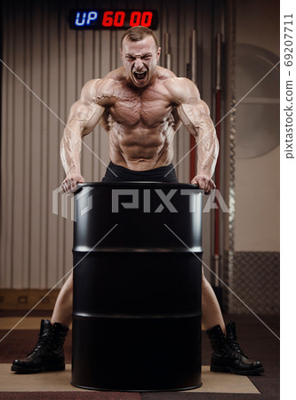 Bodybuilder athletic man workout muscles exercise 69207711