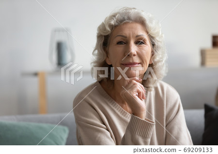 Head shot portrait beautiful middle aged woman looking at camera 69209133