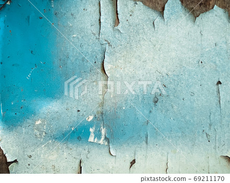Closeup on old shabby painted blue surface texture Closeup on old shabby painted blue surface texture 69211170