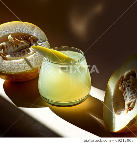 cocktail of melon . Slices of melon on selective focus cocktail of melon . Slices of melon on selective focus 69212003
