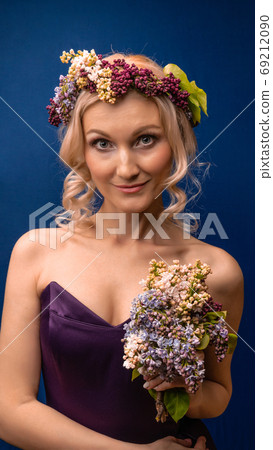 Predestined wonderful in a lilac wreath with a beautiful smile, with white daylight Predestined wonderful in a lilac wreath with a beautiful smile, with white daylight 69212090