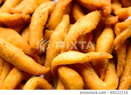 Close up Delicious Salty Spicy Namkeen Bhujia snack Texture. Close up Delicious Salty Spicy Namkeen Bhujia snack Texture. 69212118