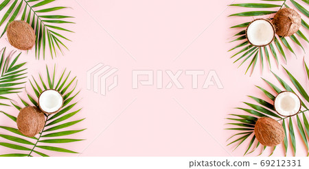 Pattern, frame borders with coconuts and tropical palm leaves on pink background. Tropical abstract background. Flat lay, top view. 69212331