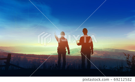 Civil engineers look at the site of future wind power station. Civil engineers look at the site of future wind power station. 69212582