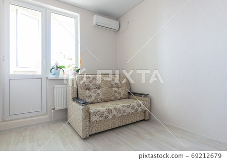 View of part of the room at the exit to the balcony, sofa and air conditioning 69212679